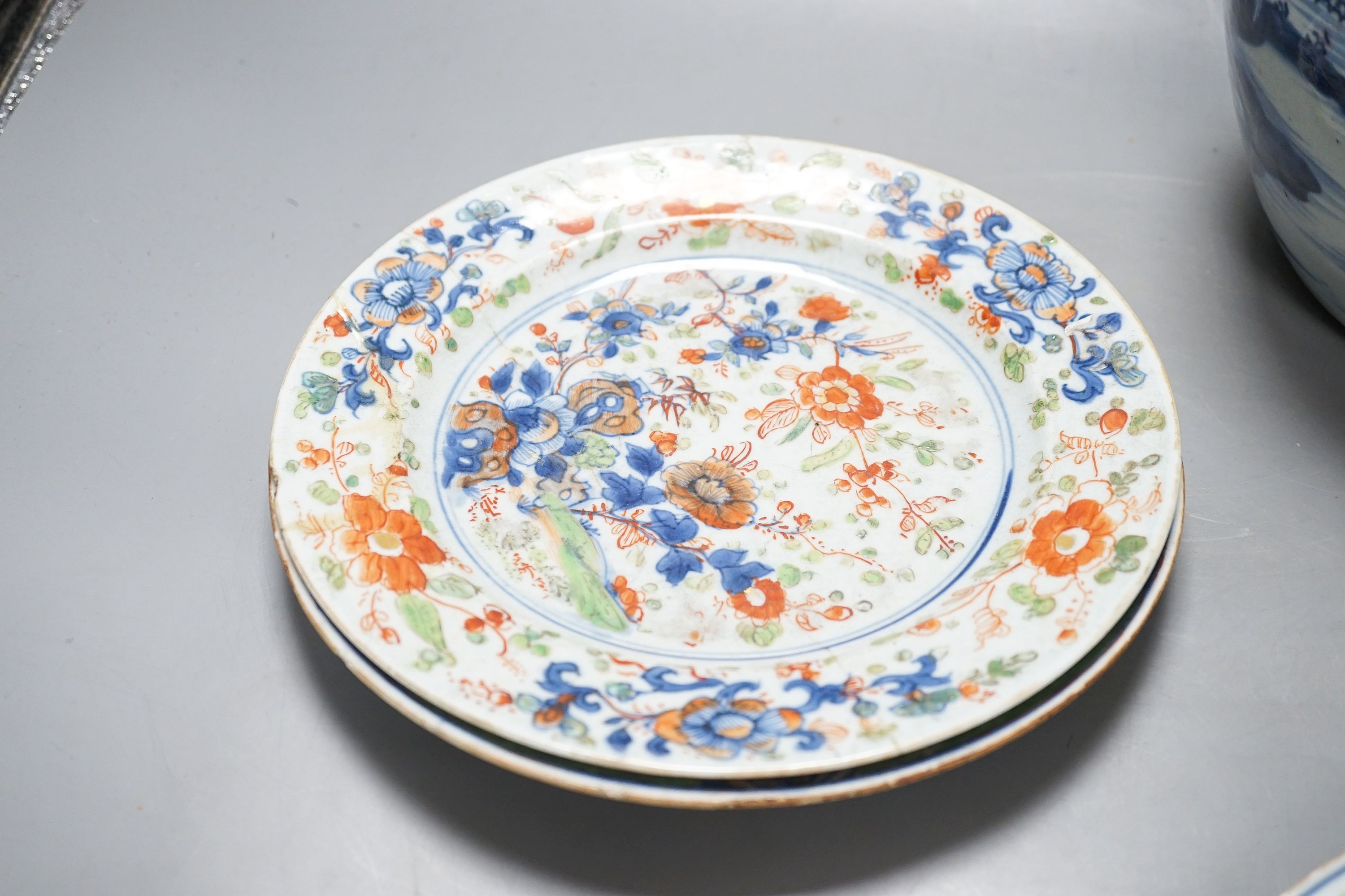An 18th century Chinese blue and white jar, three 18th century clobbered Chinese plates and a pair of Satsuma vases